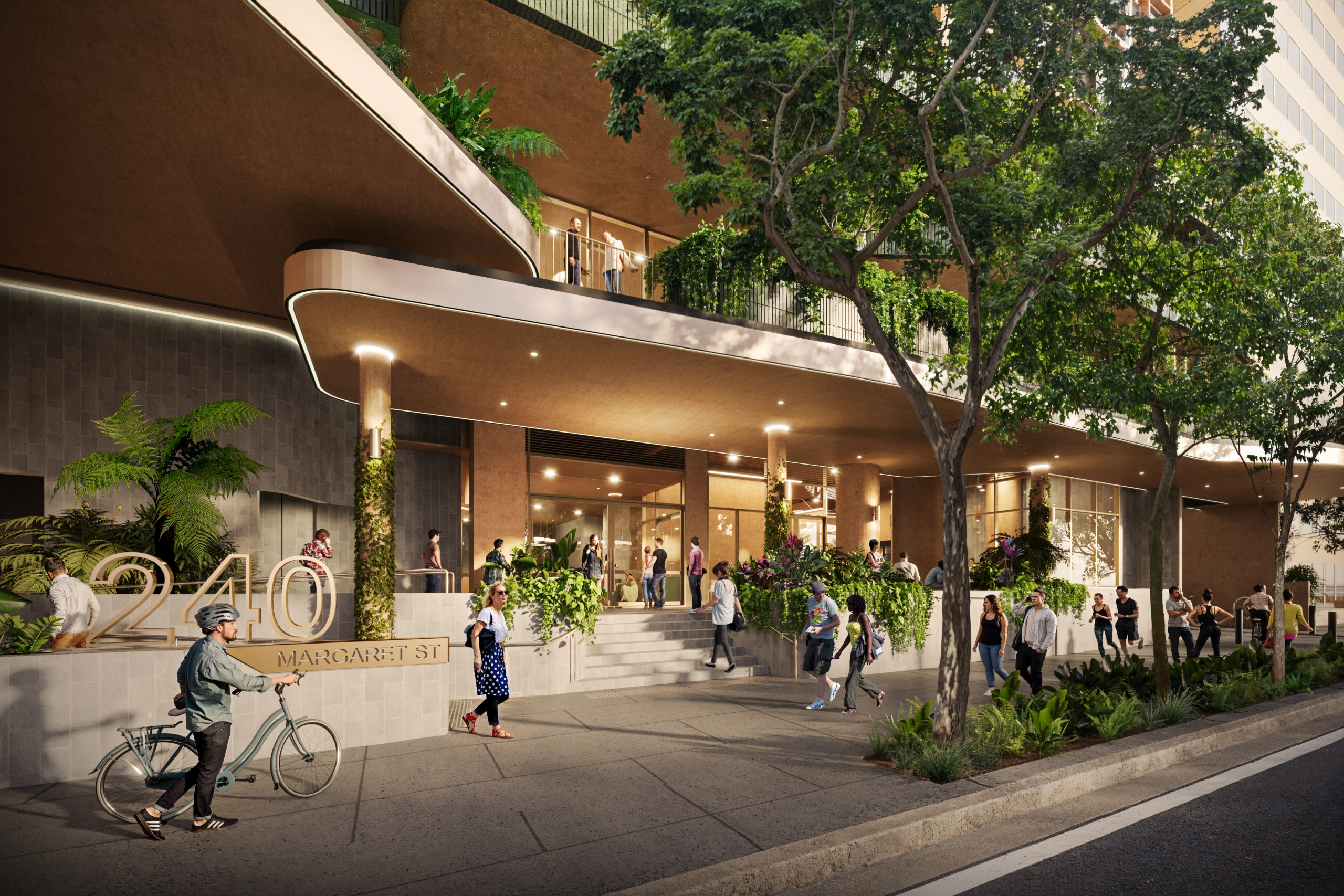 Modern building with large windows, greenery, and people gathered outside