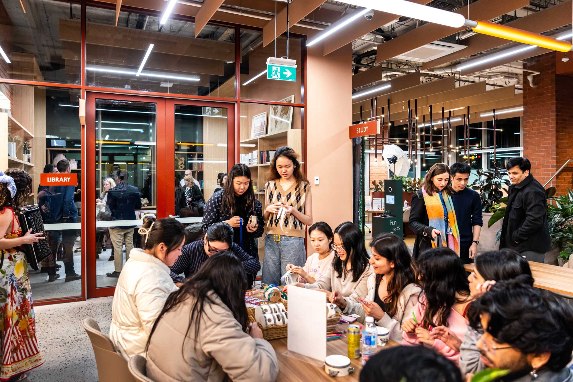 Group chatting around table in modern space.